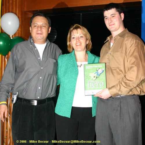 Meg Crossett presents a hero plaque to Fast Eddie's Lafter Hours