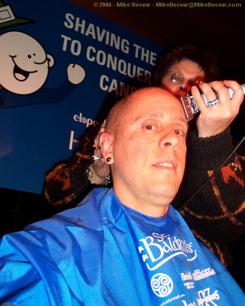 Mike Becvar in chair being shaved.