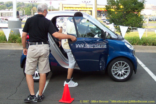 Fam getting in a blue fortwo