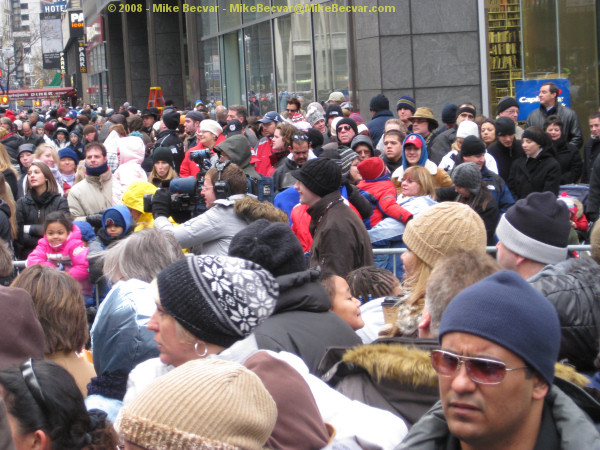 Crowds on the sidewalk behind me